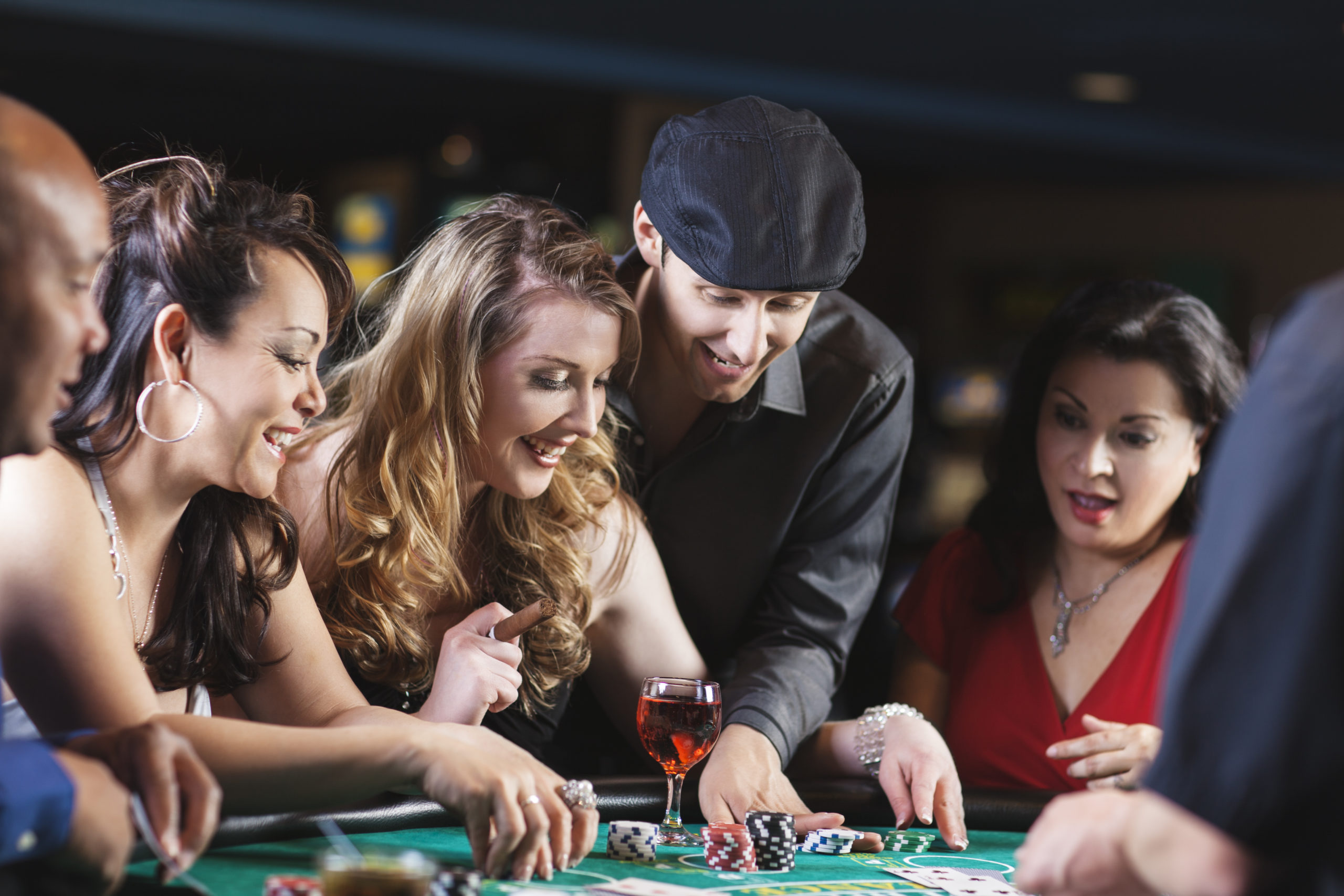 You Can Win Big Playing Blackjack at Triple Crown Casinos! Happy diverse group of friends at the blackjack table in casino. You might also be interested in these: