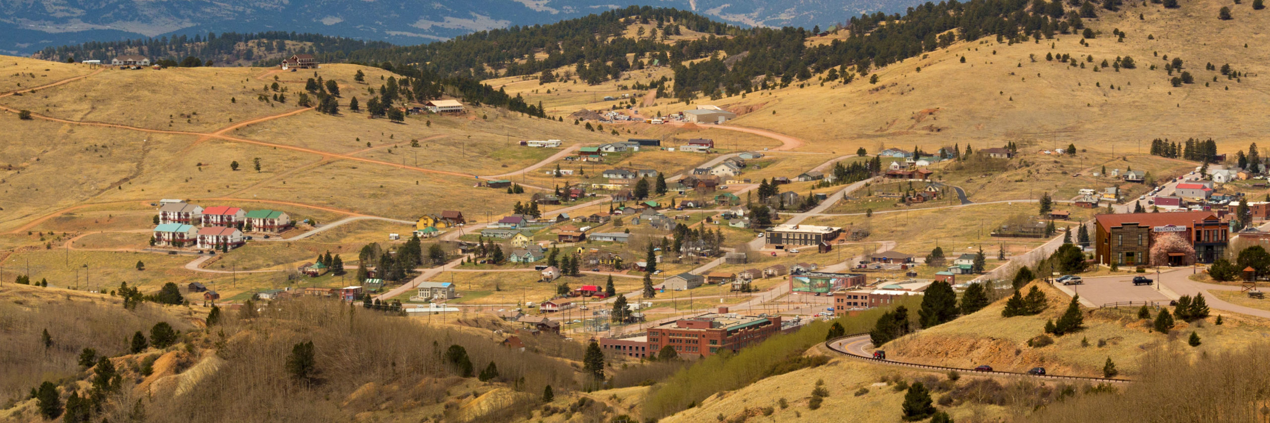 View from overlook of fun things to do in the summer at the mining town of Cripple Creek and the Sangre De Cristo mountain range