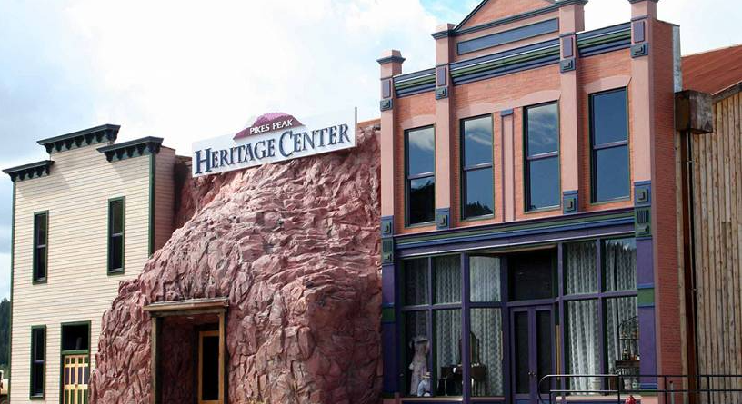 The Heritage Center in Cripple Creek Colorado is a mass of local rocks in an amorphous shape nestled in between two historic buildings