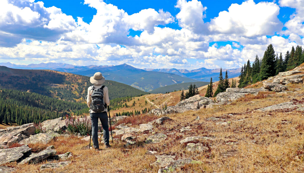 Hiker at Colorado's Ptarmigan Pass near Vail.