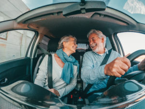 Couple of two happy senior having fun and enjoying vacations tri