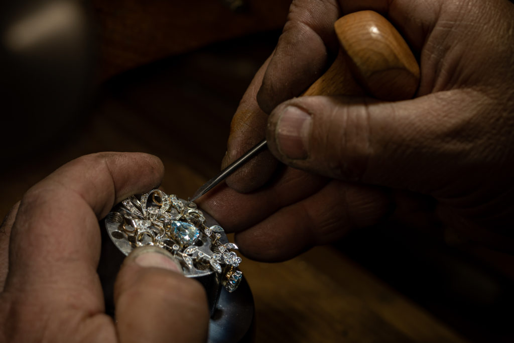 Different goldsmiths tools on the jewelry workplace. Jeweler at work in jewelry. Desktop for craft jewelry making with professional tools. Close up view of tools.