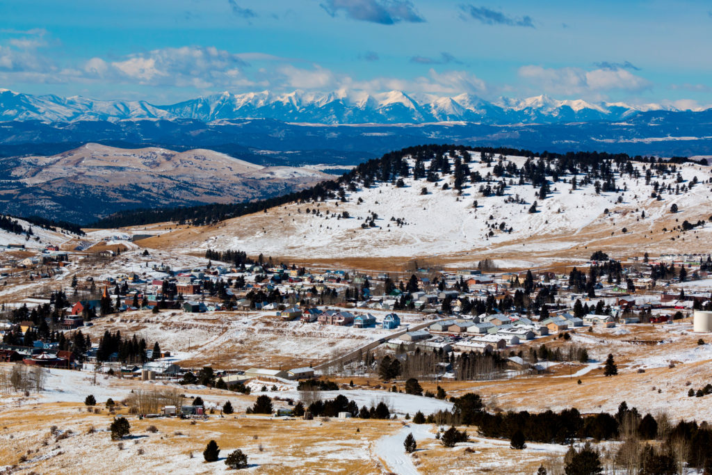 Fresh snow and clouds accentuate the city of Cripple Creek and the Sangre de Cristo mountain range on a bitterly cold February morning in Colorado