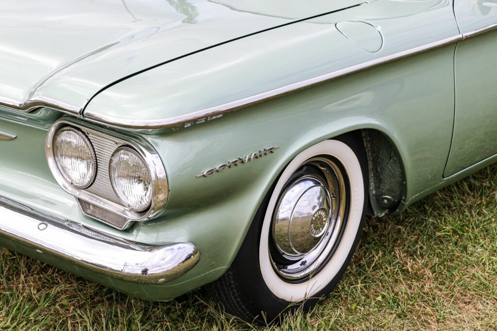 Vintage historic Chevrolet Corvair Sedan car parked on a grassy