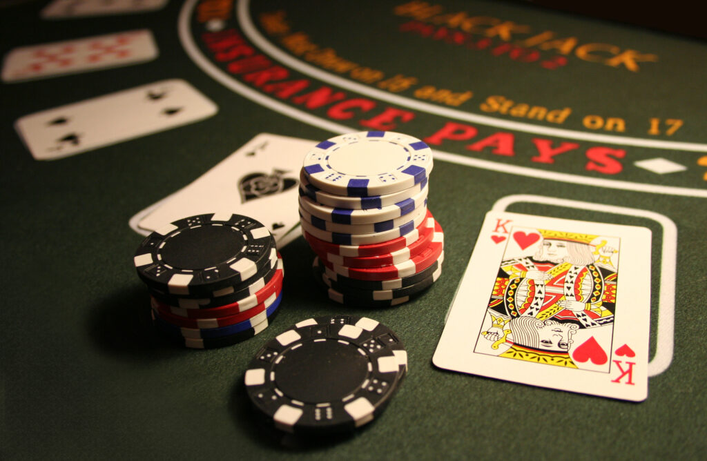 Chips set on the table at a Black Jack table inside a Casino.
